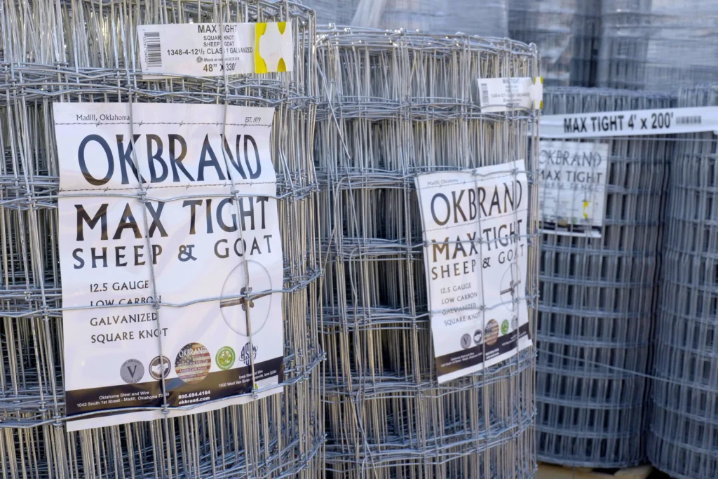 Large rolls of OK Brand Max Tight sheep and goat fencing, made of 12.5 gauge galvanized square knot wire, on display at Dutchman’s Farm Supply.